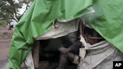 An internally displaced boy takes shelter from the rain at Kabo camp in northern Central African Republic. (File Photo)