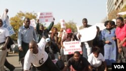 Zimbabwean civil servants take part in a demonstration over poor salaries and working conditions in Harare, Tuesday, July, 24, 2012. (FILE 
