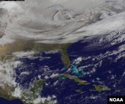 NOAA's GOES-East satellite provided a look at the frigid eastern two-thirds of the U.S. on Jan. 7, 2015, that shows a blanket of northern snow, lake-effect snow from the Great Lakes and clouds behind the Arctic cold front.