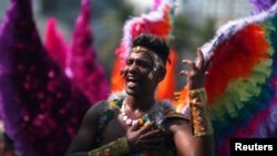 A reveller performs during the Gay Pride Parade at the Copacabana beach in Rio de Janeiro, Brazil, December 11, 2016.