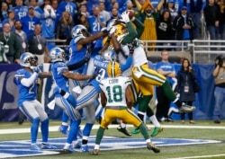 FILE - Green Bay Packers tight end Richard Rodgers (82) catches a 61-yard Hail Mary throw with no time remaining to beat the Lions 27-23 in an NFL football game, Thursday, Dec. 3, 2015, in Detroit. (AP Photo/Paul Sancya)