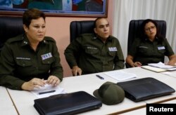 Cuban Interior Ministry officials Lieutenant Colonels Imandra Oceguera, Marco Rodriguez and Dalgys Lamorut attend an interview with Reuters, in Havana, Cuba, May 31, 2017.