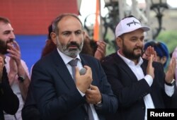 FILE - Newly elected Prime Minister of Armenia Nikol Pashinyan, center, meets with supporters in Republic Square in Yerevan, May 8, 2018.