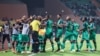 Comoros' players celebrate after scoring their third goal during the Group C Africa Cup of Nations (CAN) 2021 football match between Ghana and Comoros at Stade Roumde Adjia in Garoua on Jan. 18, 2022.