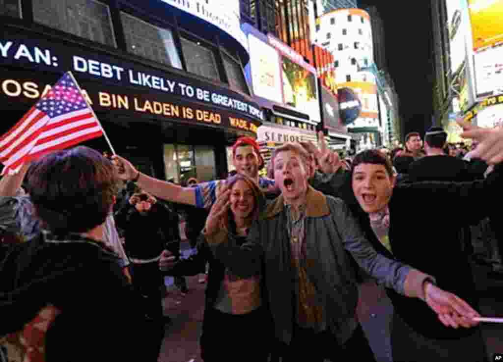 People gather in Times Square on May 2, 2011 shortly after the announcement from the President Obama announced that Al-Qaida mastermind Osama bin Laden was dead.