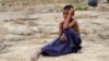 A Rohingya refugee boy sits on the ground at Tang Khali refugee camp near Cox's Bazar, Bangladesh, Oct. 18, 2017. 