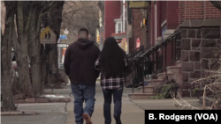 Undocumented immigrant Raul, who has been in the United States for 10 years, and his wife walk down a street in Harrisburg, Pennsylvania. (Photo: M. Kornely / VOA) 