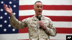 FILE - Gen. Joseph Dunford, chairman of the Joint Chiefs of Staff speaks during a ceremony on Christmas Eve at a U.S. airfield in Bagram, north of Kabul, Afghanistan, Dec. 24, 2017.
