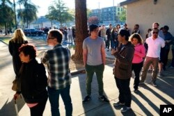 Voters wait at the North Hollywood Amelia Earhart Regional Library in Los Angeles on Nov. 8, 2016.