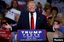 Republican presidential nominee Donald Trump speaks onstage during a campaign rally in Akron, Ohio, U.S., Aug. 22, 2016.