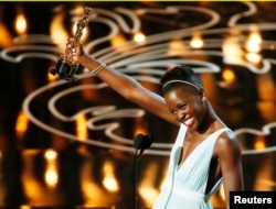 Lupita Nyong'o, best supporting actress winner for her role in "12 Years a Slave", speaks on stage at the 86th Academy Awards in Hollywood, CA. March 2, 2014.