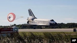FILE - Space shuttle Atlantis lands on Runway 33 at NASA Kennedy Space Center's Shuttle Landing Facility, concluding the STS-129 mission, Nov. 27, 2009.