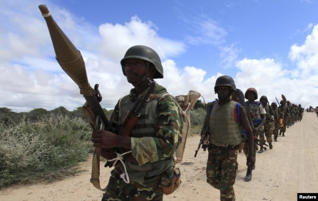 FILE - African Union Mission in Somalia (AMISOM) soldiers from Burundi patrol on the outskirts of Mogadishu, Somalia, May 22, 2012.