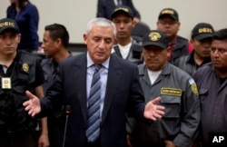 Guatemala's former President Otto Perez Molina talks to reporters after his second hearing in Guatemala City, Sept. 4, 2015.