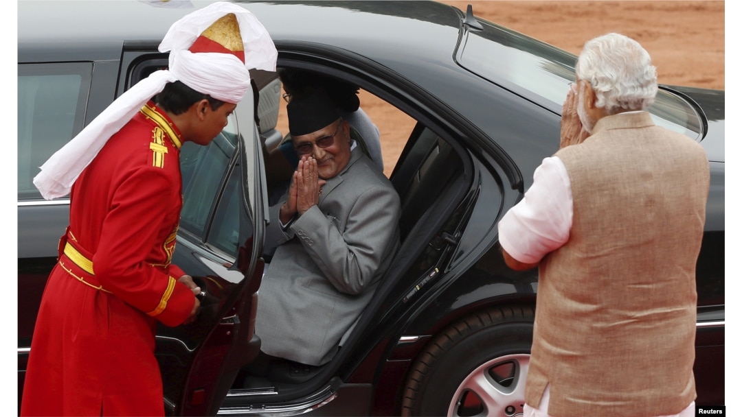 FILE - Nepal's Prime Minister Khadga Prasad Sharma Oli, center, greets his Indian counterpart, Narendra Modi, right, after his ceremonial reception at the forecourt of India's Rashtrapati Bhavan presidential palace in New Delhi, India, Feb. 20, 2016.