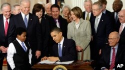 In this March 23, 2010, photo, President Barack Obama signs the Affordable Care Act, or "Obamacare," in the East Room of the White House in Washington, D.C.