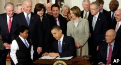 FILE - In this March 23, 2010 file photo, President Barack Obama signs the Affordable Care Act, or "Obamacare," in the East Room of the White House in Washington.