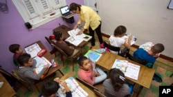 FILE - Students attend an English class at the Cuban School of Foreign Languages, in Havana, Cuba, Feb. 5, 2016. Despite ideological and legal hurdles, Cuba’s blooming entrepreneurial system has quietly created something that looks very much like a privat