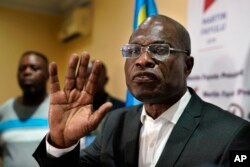 Opposition candidate Martin Fayulu speaks to the press at his headquarters in Kinshasa, Congo, Jan. 10, 2019.