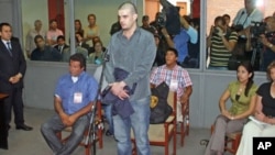 Dutch citizen Joran Van der Sloot stands in front of a judge during his trial at the Lurigancho prison in Lima, Peru, January 6, 2012.