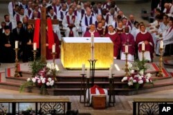 Religious officials sit during the funeral mass for Father Jacques Hamel at the Rouen cathedral, Normandy, France, Aug. 2, 2016.