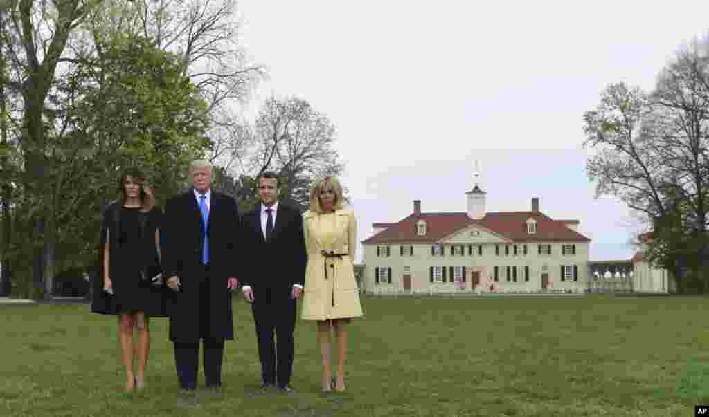 First lady Melania Trump, President Donald Trump, French President Emmanuel Macron and his wife Brigitte Macron pose for a photo during a visit and private dinner at George Washington's Mount Vernon estate in Mount Vernon, Va., April 23, 2018. 