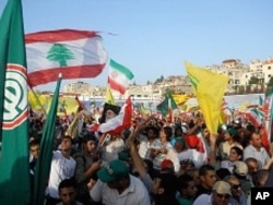 Tens of thousands of people turned out in support of the Iranian president in southern Lebanon and waved flags of Iran, Lebanon, Hezbollah and Amel, a Hezbollah-allied Shi’ite party.