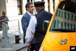 Michael Cohen, formerly a lawyer for President Trump, leaves his hotel, July 27, 2018, in New York.