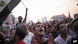 Egyptian protesters shout slogans in Cairo's Tahrir Square as the country awaits the outcome of the presidential runoff vote, June 23, 2012 (AP).