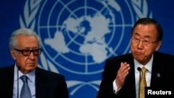 U.N. Secretary-General Ban Ki-moon sits beside U.N.-Arab League envoy for Syria Lakhdar Brahimi (L) as he addresses a news conference after the Geneva-2 peace talks in Montreux on January 22, 2014.