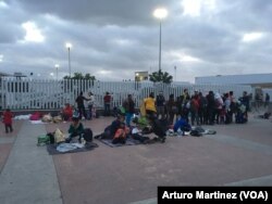 While around 50 asylum seekers entered the El Chaparral port of entry, waiting to be attended, 150 others spent the night outside the gate in Tijuana, Mexico.