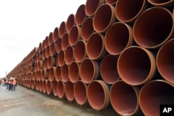 FILE - Steel pipes for the North Stream 2 pipeline are stacked in Mukran harbor in Sassnitz, Germany, May 8, 2017.