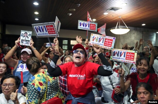 Supporters of Pheu Thai Party react after unofficial results, during the general election in Bangkok, Thailand, March 24, 2019.