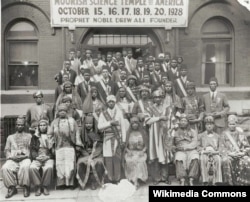 Attendees of the 1928 Moorish Science Temple Conclave in Chicago. Noble Drew Ali is in white in the front row center.
