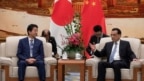 Thủ tướng Nhật Shinzo Abe được Thủ tướng Trung Quốc Lý Khắc Cường tiếp đón