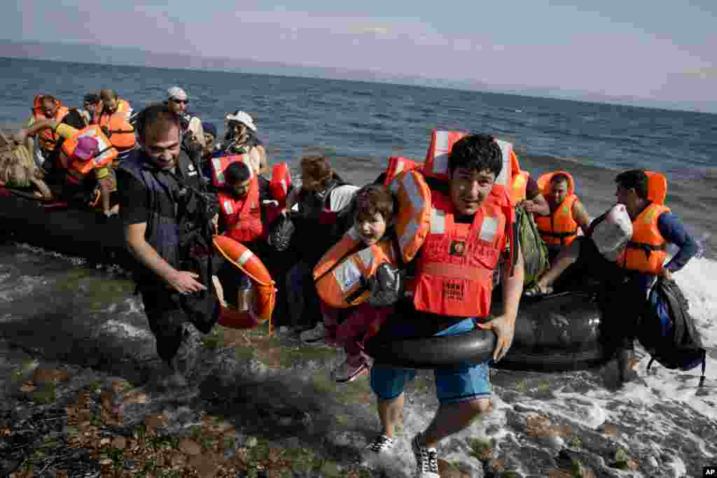 Meanwhile, more refugees arrive aboard a dinghy after crossing from Turkey to the island of Lesbos, Greece. The island of some 100,000 residents has been transformed by the sudden new population of some 20,000 refugees and migrants, mostly from Syria, Iraq and Afghanistan.