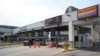 FILE - Vehicles pay a toll at the Detroit-Windsor tunnel in Detroit, Michigan, on the U.S.-Canada border, Aug. 9, 2021. 