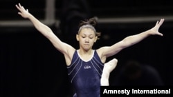 Kyla Ross leaps from the balance beam during practice for the U.S. Olympic gymnastics trials, June 27, 2012, in San Jose, California.