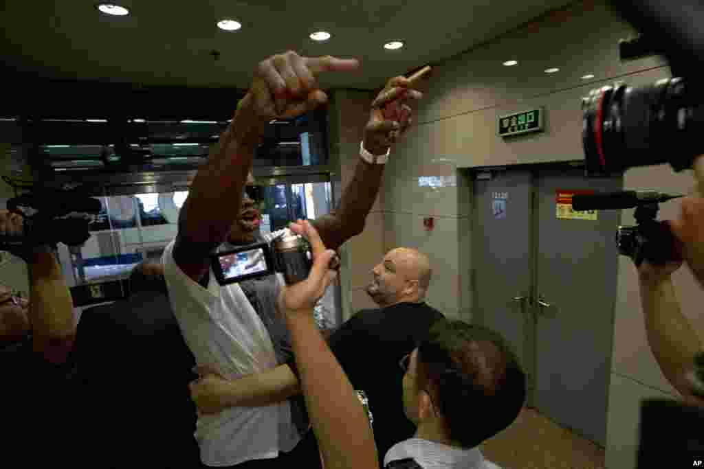 Dennis Rodman gestures as he reacts to a question about American citizen Kenneth Bae who remains imprisoned in North Korea, at Beijing Capital International Airport, Sept. 7, 2013.