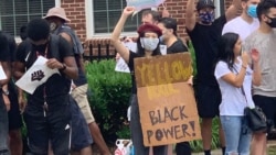 An Asian-American participating in the Black Lives Matter in Washington D.C.