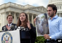 FILE - Alaa Hijazi, center, speaks about her sister Aya Hijazi, in photograph, during a news conference on Capitol Hill in Washington, Sept. 15, 2016.