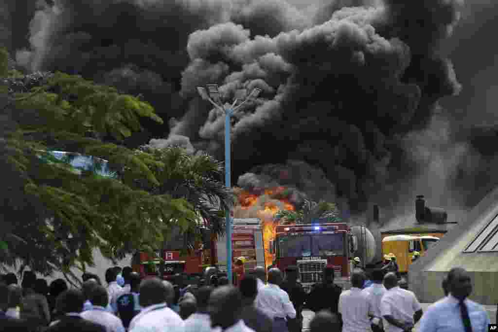 Firefighters try to contain a blaze at the Ecobank Headquarters compound in Lagos, Nigeria.