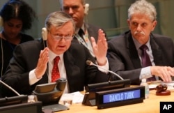 General Assembly President Mogens Lykketoft, right, listens as former Slovenian President Danilo Turk, left, address questions from the 193-member General Assembly about his candidacy for U.N. Secretary General, April 13, 2016 at U.N. headquarters.