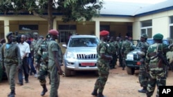 Military soldiers of Guinea-Bissau leave a building on April 13, 2012 after a meeting in Bissau. 