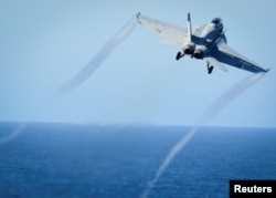 FILE - A Super Hornet takes off from the flight deck of the U.S. Navy aircraft carrier USS Nimitz, Oct. 29, 2016. A Super Hornet reportedly downed a Syrian SU-22 fighter jet Sunday.