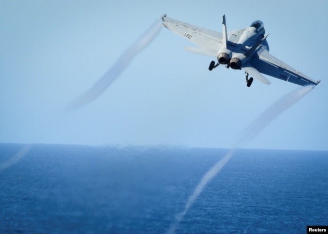 FILE - A Super Hornet takes off from the flight deck of the U.S. Navy aircraft carrier USS Nimitz, Oct. 29, 2016. A Super Hornet reportedly downed a Syrian SU-22 fighter jet Sunday.