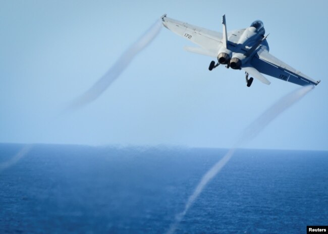 FILE - A Super Hornet takes off from the flight deck of the U.S. Navy aircraft carrier USS Nimitz, Oct. 29, 2016. A Super Hornet reportedly downed a Syrian SU-22 fighter jet Sunday.