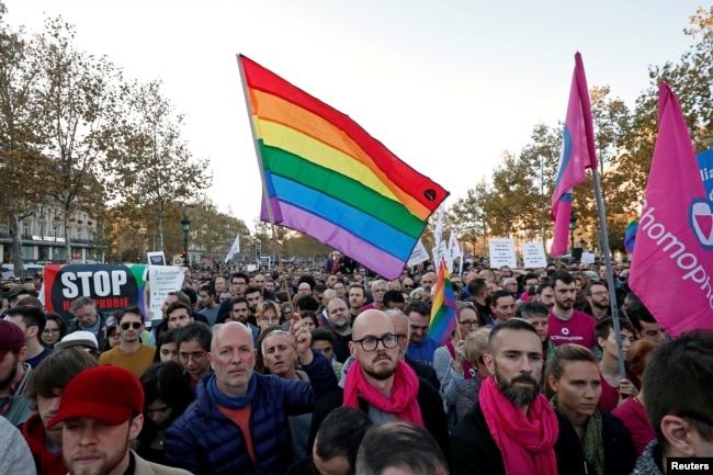 Members and supporters of the lesbian, gay, bisexual and transgender (LGBT) community protest against discrimination and violence, at the Place de la Republique in Paris, France, Oct. 21, 2018.