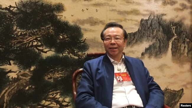 中国华融资产管理有限公司董事长赖小民2017年3月7日在北京举行全国人大会议期间接受路透社采访。