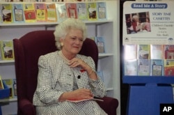 FILE - Barbara Bush visits the children's section of a bookstore in this undated photo.